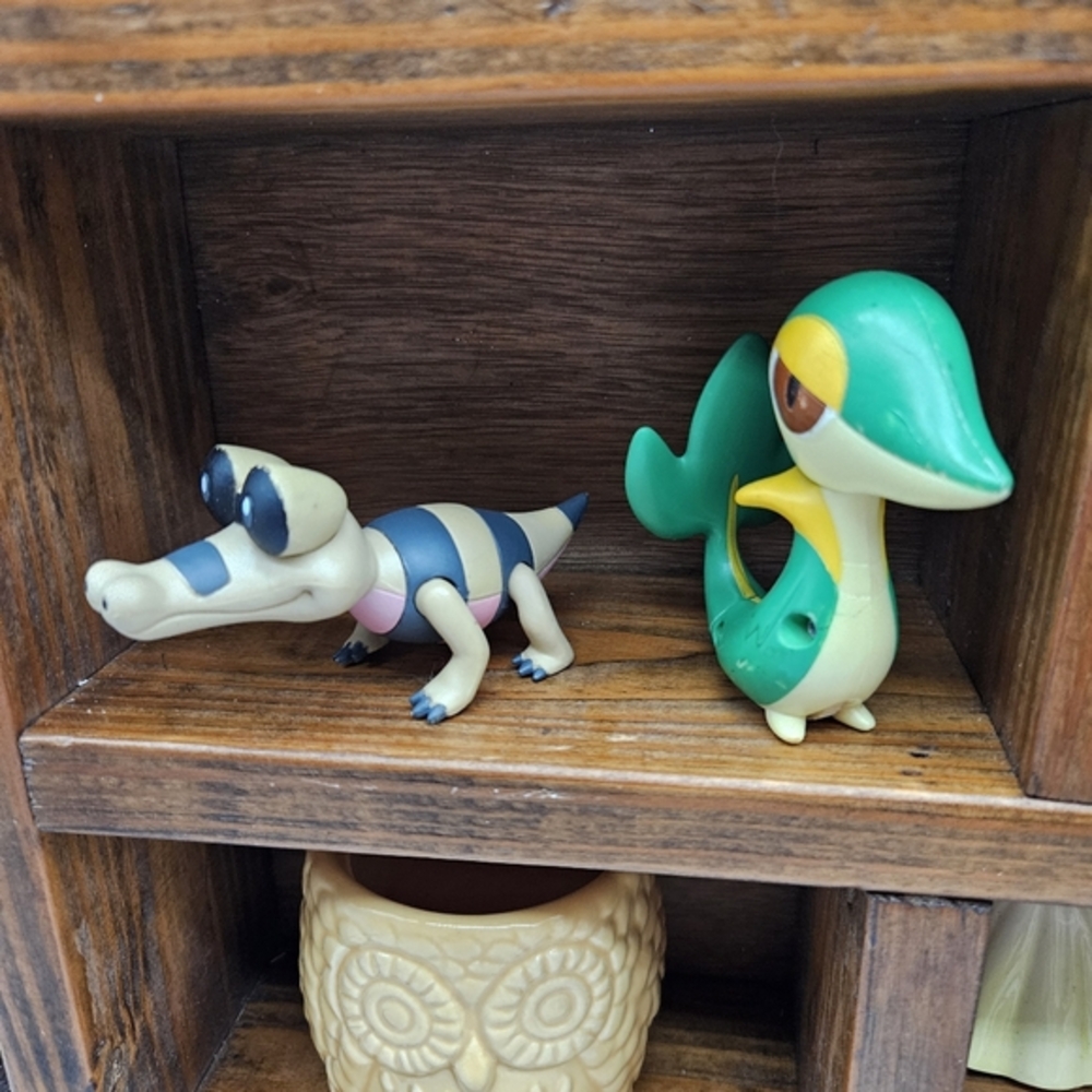 Two Pokemom. Snivy and Sandile Characters